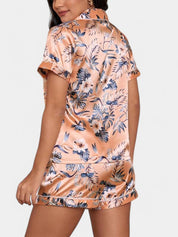 Gleame satijnen pyjamaset dames – luxe tropische print met bies