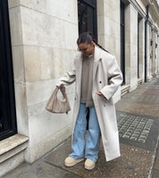 Oversized damesjas met reverskraag – lange winterjas met dubbele knopen