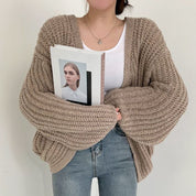 Oversized dames trui – chunky knit trui met ballonmouwen en open design