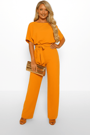 Elva jumpsuit met strikceintuur – elegante dames overall voor dag en avond